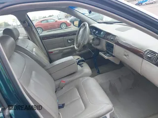 1999 Cadillac DeVille DHS z VIN 1G6KE54Y9XU766791, wystawiony jako IAAI lot #42005553 z przebiegiem 140 515 mil mil oraz . Historia ofert i sprzedaży dostępna na DreamBid. Obrazek 5.