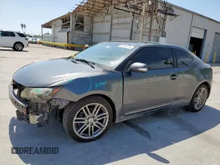 2011 Scion tC z VIN JTKJF5C73B3011223, wystawiony jako Copart lot #57032115 z przebiegiem 201 692 mil mil oraz Szkoda całkowita • Salvage title. Historia ofert i sprzedaży dostępna na DreamBid. Obrazek 1.
