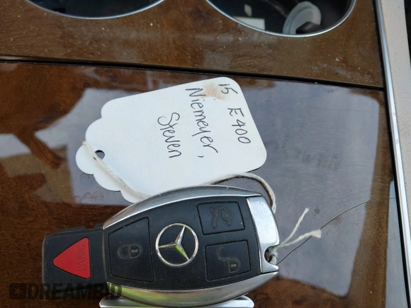 2015 Mercedes-Benz E-Class E 400 with VIN WDDKJ6FB4FF307393, listed as a IAAI auction lot 41775634 with 100,928 mi miles. Bid and sale history available at carsss.com. Image 11.
