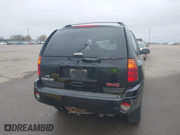 2002 GMC Envoy SLT with VIN 1GKDT13S222143135, listed as a IAAI auction lot 42136672 with 206,064 mi miles. Bid and sale history available at carsss.com. Image 12.