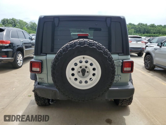 2023 Jeep Wrangler Sport with VIN 1C4HJXDN0PW643485, listed as a Copart auction lot 59783564 with 14,001 mi miles and Salvage Title. Bid and sale history available at DreamBid. Image 6.