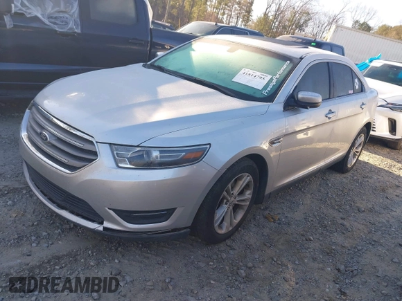 2015 Ford Taurus SEL with VIN 1FAHP2E84FG189640, listed as a IAAI auction lot 41814795 with 100,209 mi miles and . Bid and sale history available at DreamBid. Image 2.