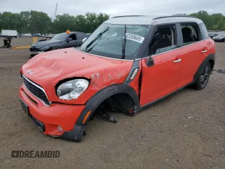 2012 MINI Countryman S with VIN WMWZC3C50CWL87834, listed as a Copart auction lot 62269645 with 94,738 mi miles and Salvage title. Bid and sale history available at DreamBid. Image 1.