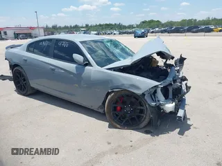 2021 Dodge Charger Scat Pack Widebody z VIN 2C3CDXGJXMH544228, wystawiony jako IAAI lot #42226915 z przebiegiem 75 737 mil mil oraz . Historia ofert i sprzedaży dostępna na DreamBid. Obrazek 1.