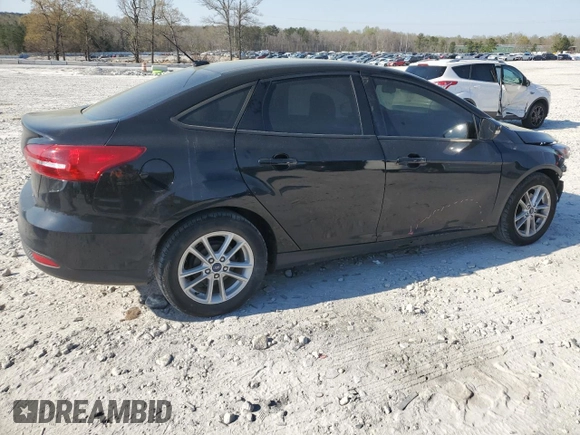 2017 Ford Focus SE with VIN 1FADP3F26HL331253, listed as a Copart auction lot 50869865 with 60,776 mi miles and Salvage title. Bid and sale history available at DreamBid. Image 3.