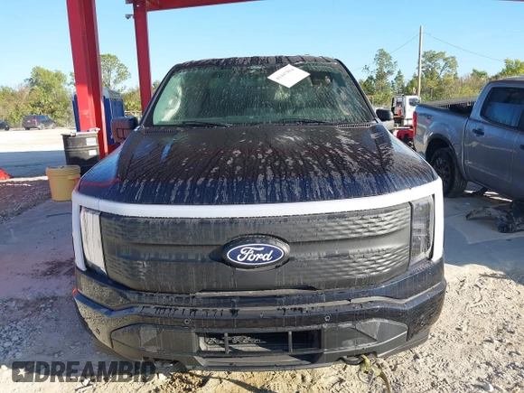 2024 Ford F-150 Lightning z VIN 1FTVW3L72RWG23113, wystawiony jako IAAI lot #41447854 z przebiegiem 1 917 mil mil oraz . Historia ofert i sprzedaży dostępna na DreamBid. Obrazek 12.
