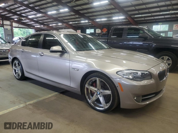 2013 BMW 5 Series 535i xDrive with VIN WBAFU7C57DDU74909, listed as a Copart auction lot 64053715 with 115,521 mi miles and Clean title. Bid and sale history available at DreamBid. Image 4.