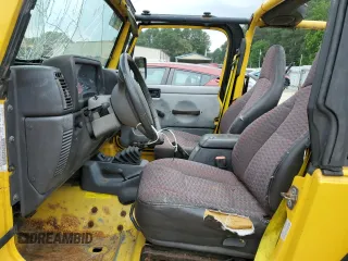 2000 Jeep Wrangler Sport with VIN 1J4FA49SXYP789791, listed as a Copart auction lot 60538875 with Not provided miles and Salvage title. Bid and sale history available at DreamBid. Image 7.