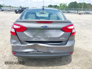 2013 Ford Focus SE z VIN 1FADP3F27DL267203, wystawiony jako IAAI lot #42470614 z przebiegiem 180 153 mil mil oraz . Historia ofert i sprzedaży dostępna na DreamBid. Obrazek 17.