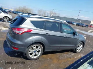 2014 Ford Escape Titanium with VIN 1FMCU9J99EUA75276, listed as a IAAI auction lot 42148537 with 163,330 mi miles and . Bid and sale history available at DreamBid. Image 13.