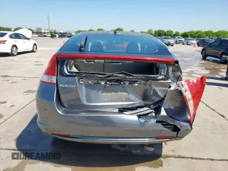 2010 Honda Insight LX with VIN JHMZE2H56AS042097, listed as a Copart auction lot 53972215 with 107,182 mi miles and Salvage Title. Bid and sale history available at DreamBid. Image 6.