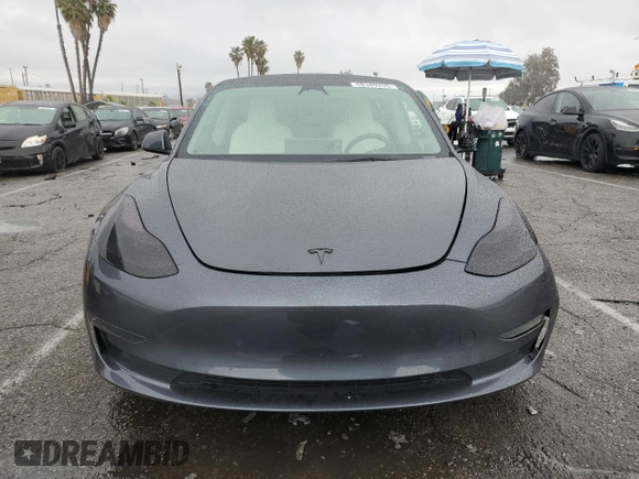 2023 Tesla Model 3 with VIN 5YJ3E1EA5PF640805, listed as a Copart auction lot 48389265 with 28,193 mi miles and Salvage title. Bid and sale history available at DreamBid. Image 5.