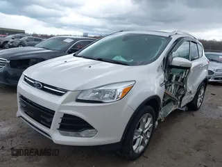 2016 Ford Escape Titanium with VIN 1FMCU9JX9GUA62674, listed as a IAAI auction lot 41838996 with 135,105 mi miles. Bid and sale history available at carsss.com. Image 2.