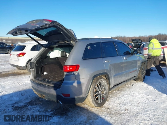 2017 Jeep Grand Cherokee Trailhawk with VIN 1C4RJFLT4HC657682, listed as a IAAI auction lot 41286507 with 123,646 mi miles and . Bid and sale history available at DreamBid. Image 4.