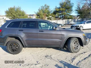 2021 Jeep Grand Cherokee 80th Anniversary z VIN 1C4RJFBG5MC737412, wystawiony jako IAAI lot #41753550 z przebiegiem 54 921 mil mil oraz . Historia ofert i sprzedaży dostępna na DreamBid. Obrazek 13.