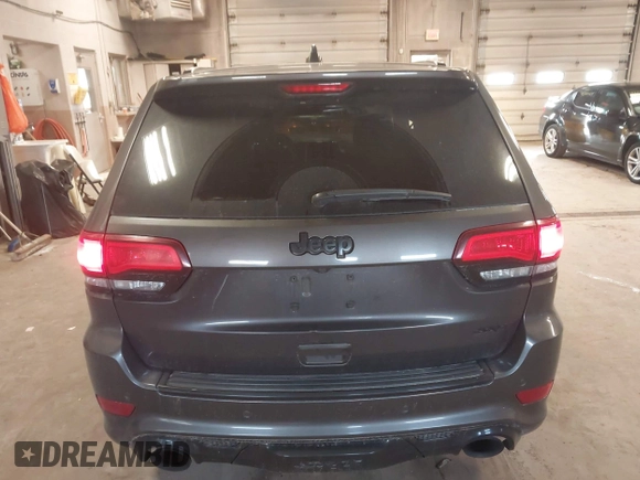 2018 Jeep Grand Cherokee SRT z VIN 1C4RJFDJ6JC432683, wystawiony jako IAAI lot #41971436 z przebiegiem 113 078 mil mil oraz . Historia ofert i sprzedaży dostępna na DreamBid. Obrazek 15.