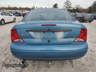 2001 Ford Focus LX with VIN 1FAHP33P01W332260, listed as a Copart auction lot 83221654 with 104,028 mi miles and Salvage Title. Bid and sale history available at DreamBid. Image 6.