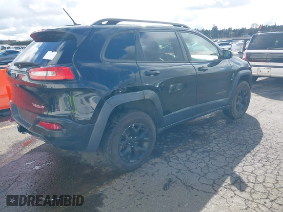 2015 Jeep Cherokee Trailhawk with VIN 1C4PJMBS7FW699392, listed as a IAAI auction lot 41797617 with 1 mi miles. Bid and sale history available at carsss.com. Image 4.