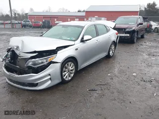 2017 Kia Optima EX with VIN 5XXGU4L37HG129248, listed as a IAAI auction lot 40833561 with 120,671 mi miles. Bid and sale history available at carsss.com. Image 2.