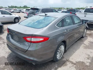 2013 Ford Fusion SE Hybrid with VIN 3FA6P0LU9DR247484, listed as a IAAI auction lot 42110685 with 202,531 mi miles. Bid and sale history available at carsss.com. Image 4.