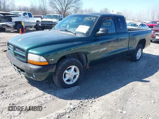1999 Dodge Dakota SLT z VIN 1B7GL22X0XS128071, wystawiony jako IAAI lot #42010239 z przebiegiem 150 495 mil mil oraz . Historia ofert i sprzedaży dostępna na DreamBid. Obrazek 2.