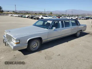 1992 Cadillac Brougham z VIN 1G6DW5474NR713140, wystawiony jako Copart lot #76990784 z przebiegiem 63 153 mil mil oraz Tytuł czysty. Historia ofert i sprzedaży dostępna na DreamBid. Obrazek 1.