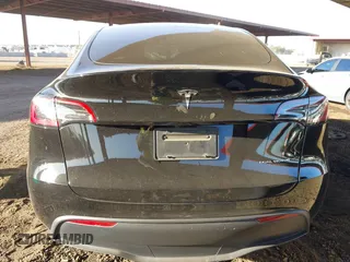 2023 Tesla Model Y Long Range with VIN 7SAYGDEE8PF815622, listed as a IAAI auction lot 41515433 with 70,862 mi miles and . Bid and sale history available at DreamBid. Image 16.