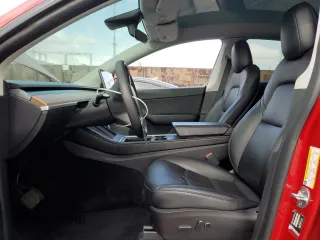 2021 Tesla Model Y Long Range with VIN 5YJYGDEEXMF217816, listed as a Copart auction lot 51008665 with 57,392 mi miles and Salvage Title. Bid and sale history available at DreamBid. Image 7.
