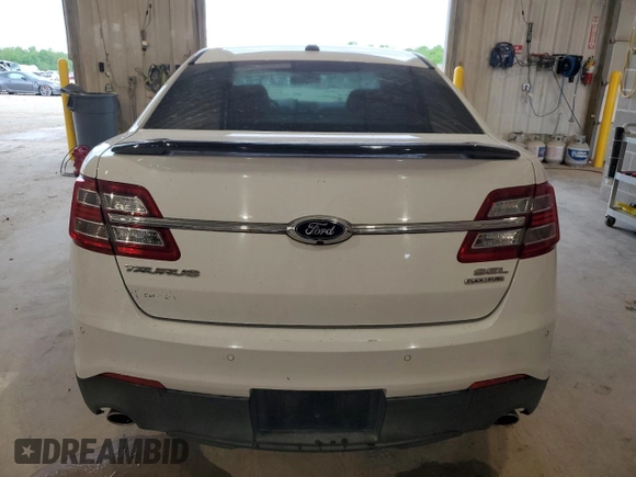 2014 Ford Taurus SEL z VIN 1FAHP2E89EG121025, wystawiony jako Copart lot #55405535 z przebiegiem 168 004 mil mil oraz Czysty tytuł • Clean title. Historia ofert i sprzedaży dostępna na DreamBid. Obrazek 6.