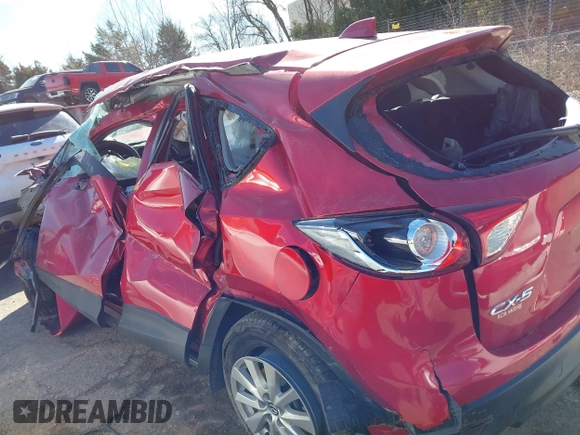 2014 Mazda CX-5 Touring z VIN JM3KE2CY2E0364488, wystawiony jako IAAI lot #41635188 z przebiegiem 127 688 mil mil oraz . Historia ofert i sprzedaży dostępna na DreamBid. Obrazek 14.