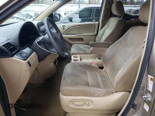 2010 Honda Odyssey EX with VIN 5FNRL3H59AB038104, listed as a Copart auction lot 84688894 with 317,028 mi miles and Salvage title. Bid and sale history available at DreamBid. Image 7.