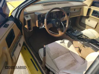 1986 Pontiac Fiero z VIN 1G2PG9796GP256622, wystawiony jako Copart lot #69203894 z przebiegiem 38 964 mil mil oraz Szkody całkowita. Historia ofert i sprzedaży dostępna na DreamBid. Obrazek 8.