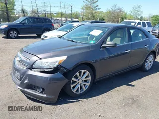 2013 Chevrolet Malibu LTZ with VIN 1G11J5SX6DF335333, listed as a IAAI auction lot 42135480 with 158,743 mi miles and . Bid and sale history available at DreamBid. Image 2.