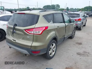 2013 Ford Escape SE with VIN 1FMCU9GX2DUC43098, listed as a IAAI auction lot 42687520 with 104,084 mi miles and . Bid and sale history available at DreamBid. Image 4.