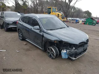2017 BMW X1 xDrive28i with VIN WBXHT3C37H5F86637, listed as a IAAI auction lot 41300161 with 95,459 mi miles. Bid and sale history available at carsss.com. Image 1.
