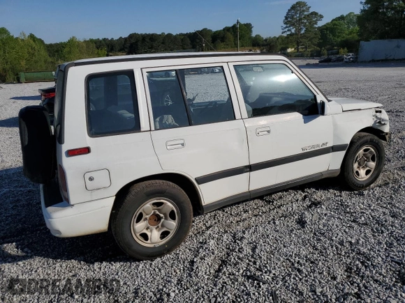 1997 Geo Tracker LSi z VIN 2CNBE1360V6927915, wystawiony jako Copart lot #53469605 z przebiegiem 119 413 mil mil oraz Szkoda całkowita • Salvage title. Historia ofert i sprzedaży dostępna na DreamBid. Obrazek 3.