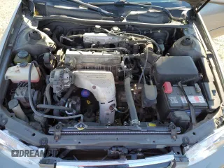 2000 Toyota Camry CE z VIN 4T1BG22K0YU692937, wystawiony jako Copart lot #57456985 z przebiegiem 116 617 mil mil oraz Szkoda całkowita • Salvage title. Historia ofert i sprzedaży dostępna na DreamBid. Obrazek 11.