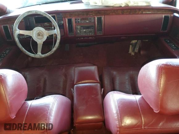 1993 Cadillac Fleetwood z VIN 1G6DW5270PR704750, wystawiony jako Copart lot #88751055 z przebiegiem Nie podano mil oraz Szkody całkowita. Historia ofert i sprzedaży dostępna na DreamBid. Obrazek 8.