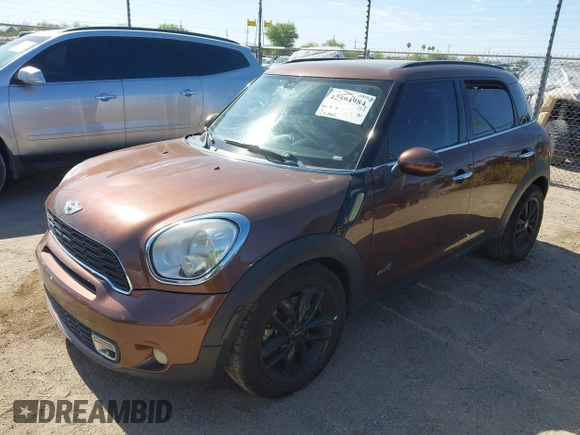 2013 MINI Countryman S ALL4 with VIN WMWZC5C58DWP30998, listed as a IAAI auction lot 42594984 with 153,792 mi miles and . Bid and sale history available at DreamBid. Image 2.