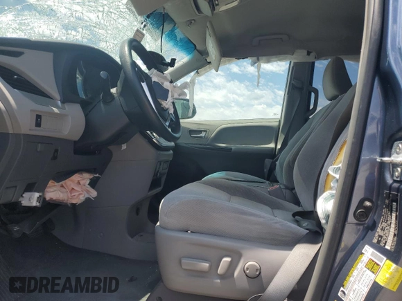 2015 Toyota Sienna LE with VIN 5TDJK3DC4FS107711, listed as a Copart auction lot 57693005 with 141,370 mi miles and Salvage title. Bid and sale history available at DreamBid. Image 7.