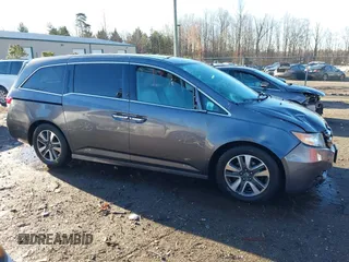 2014 Honda Odyssey Touring with VIN 5FNRL5H94EB081267, listed as a IAAI auction lot 41199509 with 146,827 mi miles and . Bid and sale history available at DreamBid. Image 6.