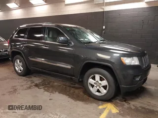 2011 Jeep Grand Cherokee 70th Anniversary with VIN 1J4RR4GG3BC566690, listed as a IAAI auction lot 41810545 with 173,886 mi miles. Bid and sale history available at carsss.com. Image 1.