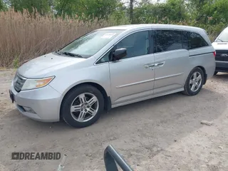 2012 Honda Odyssey Touring with VIN 5FNRL5H92CB055473, listed as a IAAI auction lot 42128601 with 163,901 mi miles. Bid and sale history available at carsss.com. Image 2.