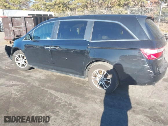 2011 Honda Odyssey EX-L with VIN 5FNRL5H61BB059275, listed as a IAAI auction lot 41293690 with 105,511 mi miles and . Bid and sale history available at carsss.com. Image 3.