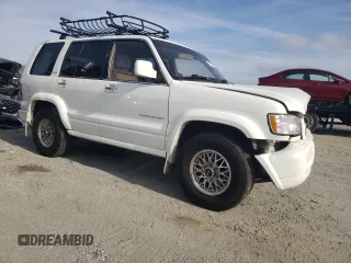 2000 Isuzu Trooper S with VIN JACDJ58X6Y7J06807, listed as a Copart auction lot 79179454 with 157,308 mi miles and Salvage title. Bid and sale history available at DreamBid. Image 4.