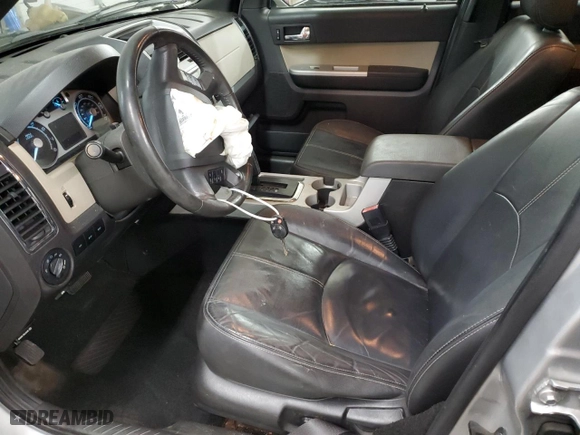 2010 Mercury Mariner Premier with VIN 4M2CN8HG4AKJ10385, listed as a Copart auction lot 70435004 with 133,615 mi miles and Salvage Title. Bid and sale history available at carsss.com. Image 7.