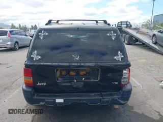 1996 Jeep Grand Cherokee Limited z VIN 1J4GZ78Y3TC191000, wystawiony jako IAAI lot #42259621 z przebiegiem 212 690 mil mil oraz . Historia ofert i sprzedaży dostępna na DreamBid. Obrazek 16.