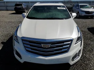 2019 Cadillac XT5 Luxury FWD z VIN 1GYKNCRS6KZ271427, wystawiony jako Copart lot #58873725 z przebiegiem Nie podano mil oraz Szkody całkowita. Historia ofert i sprzedaży dostępna na DreamBid. Obrazek 5.
