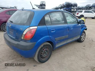 2009 Kia Rio LX with VIN KNADE243296494243, listed as a IAAI auction lot 41307888 with 133,487 mi miles. Bid and sale history available at carsss.com. Image 4.