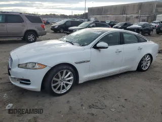 2013 Jaguar XJ with VIN SAJWJ1CD1D8V51784, listed as a Copart auction lot 88931385 with 136,958 mi miles and Clean Title. Bid and sale history available at carsss.com. Image 1.